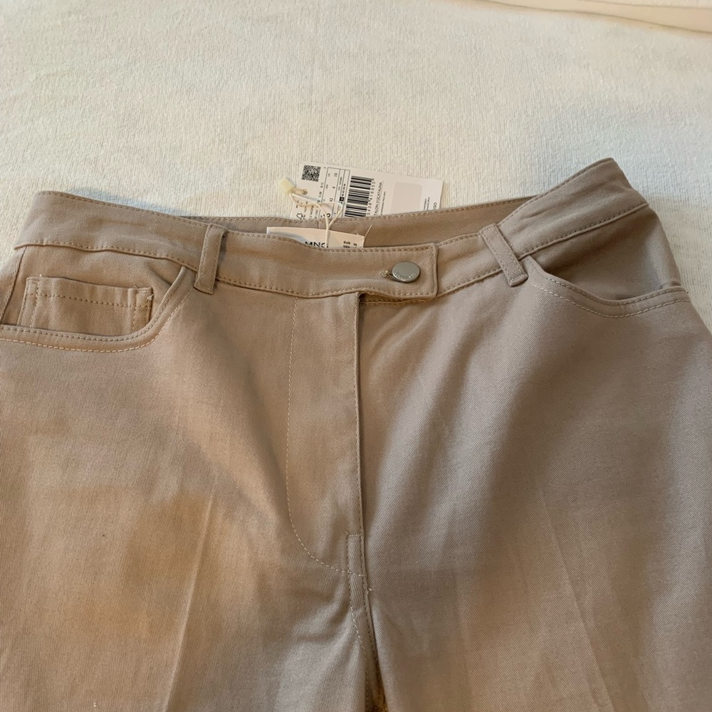 Brand new beige pants from mango store mid rise , boot cut  little flare .